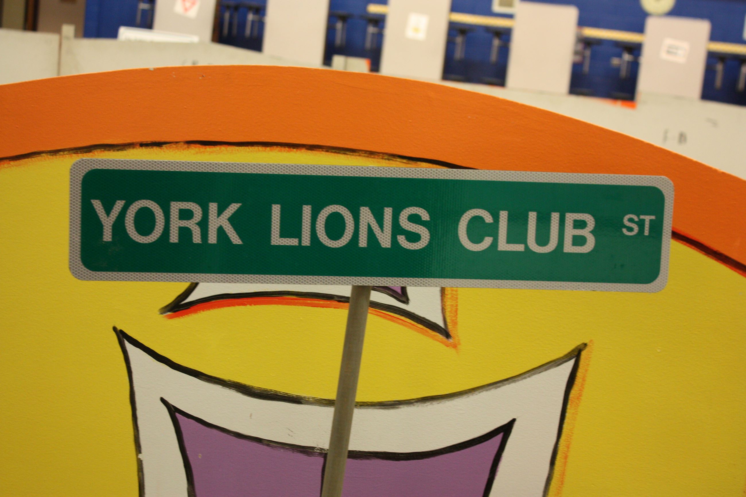 A small green street sign.